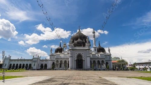 timelapse of moving clouds over Zahir mosque photo