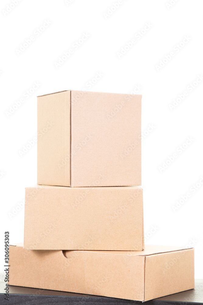 Cardboard Boxes brown closed in table white background Cardboard Boxes brown closed in table white background