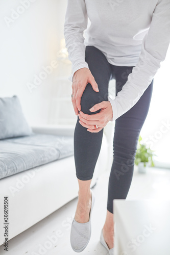 Canvas Print Physical injury of leg / knee / joint at home.