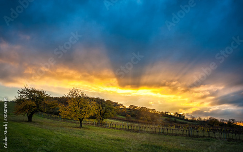 sunset and dramatic clouds on a hill called goldberg in burgenland