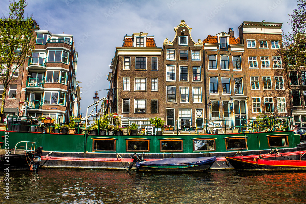 Typical buildings, canal and bikes in Amsterdam, Netherlands