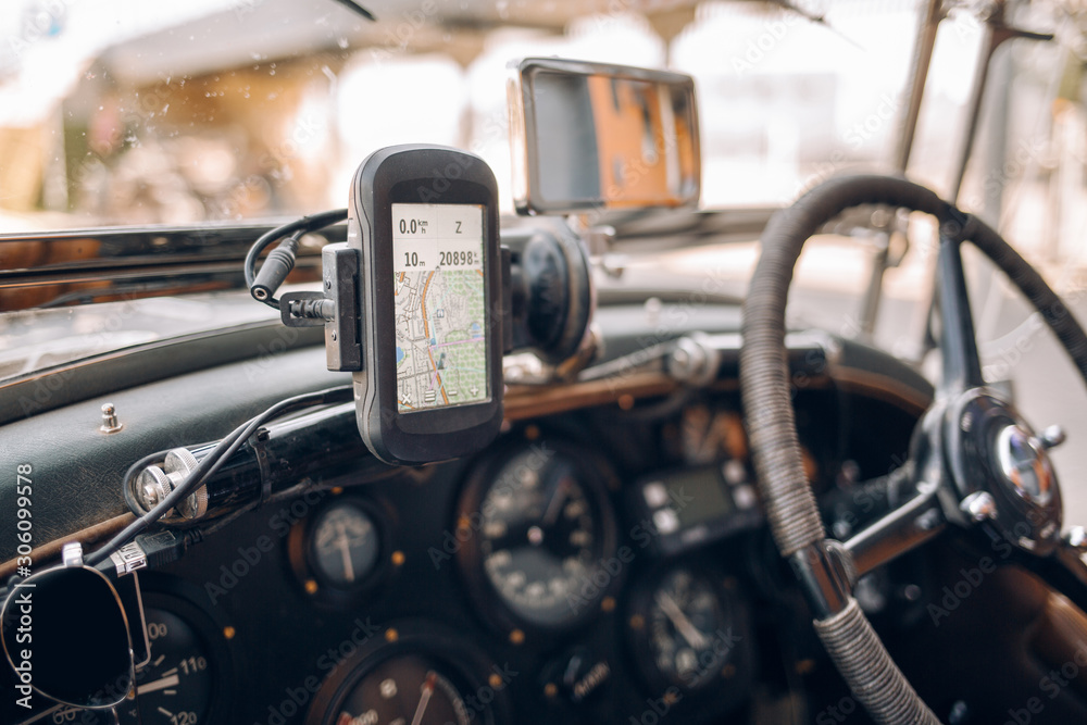 Old classic retro car with gps navigation system Old classic retro car with gps navigation system