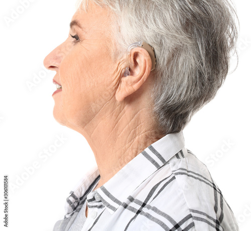 Senior woman with hearing a...
