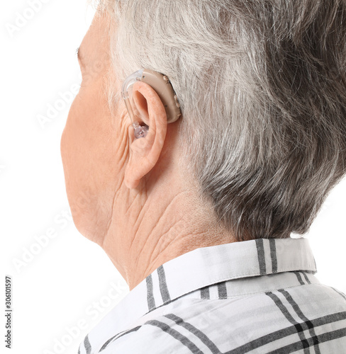 Senior woman with hearing a...