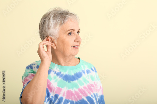 Senior woman with hearing a...