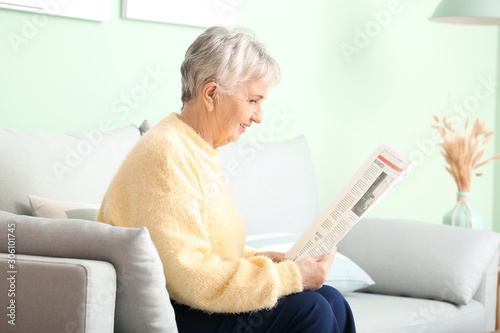 Senior woman with hearing a...