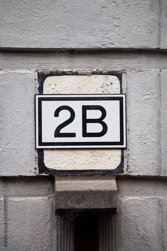 number 2b on white wall