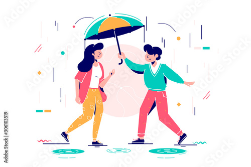 Young handsome man protects attractive woman from rain.