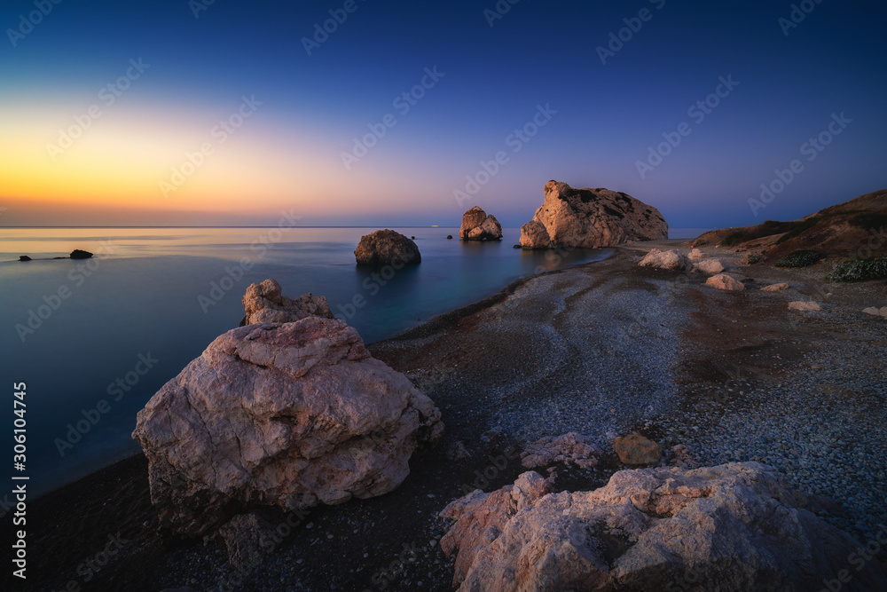 Sunrise at Petra tou Romiou - Aphrodite's rock a famous tourist travel destination landmark in Paphos, Cyprus