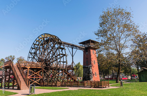 Windmill and water mill among greenery in Sakarya City Square park