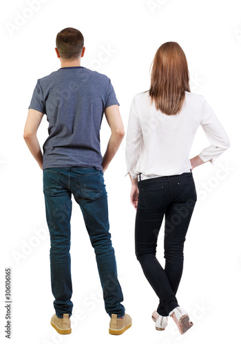 Back view of couple. beautiful friendly girl and guy together.