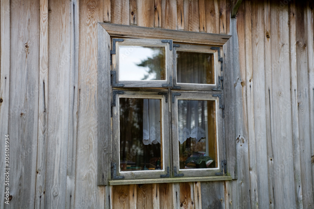 antique window in a wooden house in the open-air museum of the Polish countryside antique window in a wooden house in the open-air museum of the Polish countryside