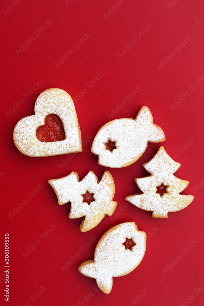 Fototapeta premium Homemade linzer cookies filled with red jam and dusted with powdered sugar