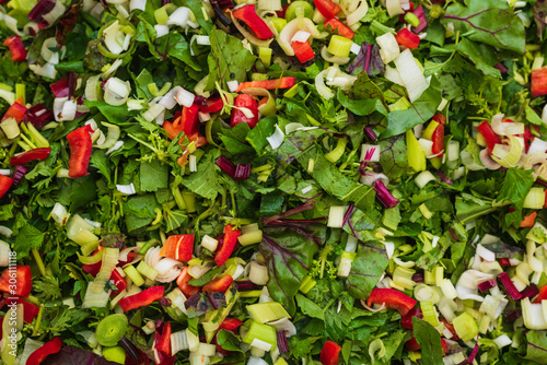 Mixed vegetables such as chopped leek, red pepper and spinach. Vegetables for...
