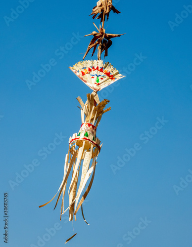 Traditional Balinese decoration blowing in the wind.
