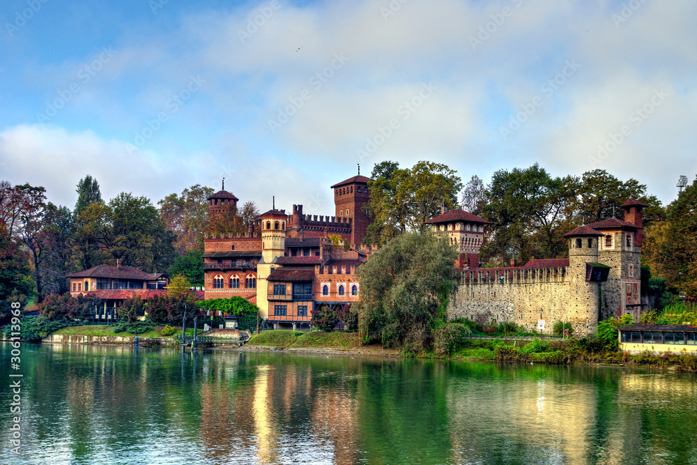 Medieval fortress in Valentino Park, Turin, Piedmont. The buildings, built as a pavilion of the Italian General Exhibition in Turin in 1884, represent castles from the 15th century. Autumn view.