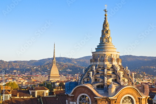 Mole Antonelliana and the Chapel of the Holy Shroud in Turin, Italy, seen from the cathedral bell tower at sunset