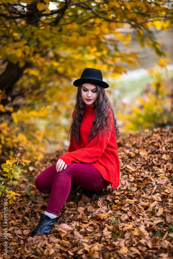 Portrait of a beautiful hispanic young woman in an autumnal forest Portrait of a beautiful hispanic young woman in an autumnal forest