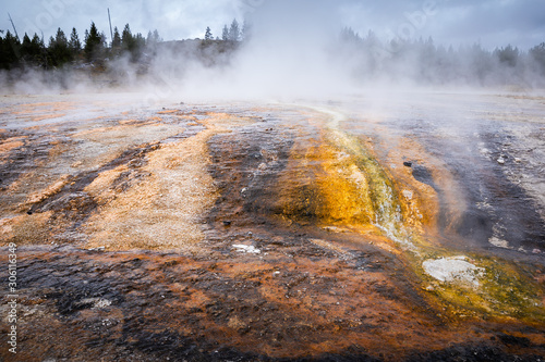 Geyser basin with boiling water from geothermal heat.