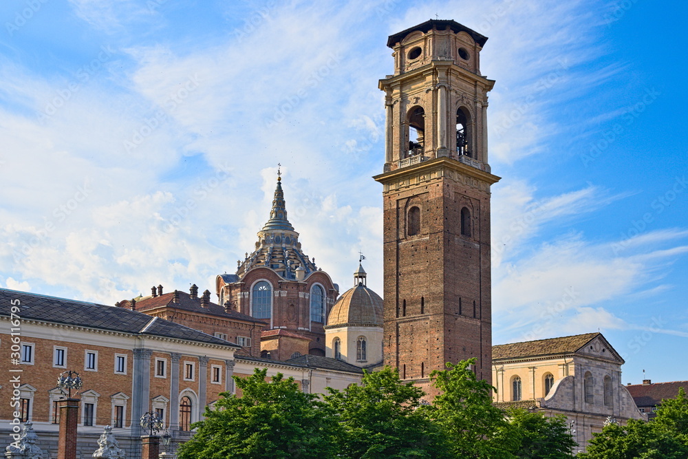 Turin Cathedral with Guarini Dome, bell tower and Roman walls remains seen at sunset from the Palatine Gate park