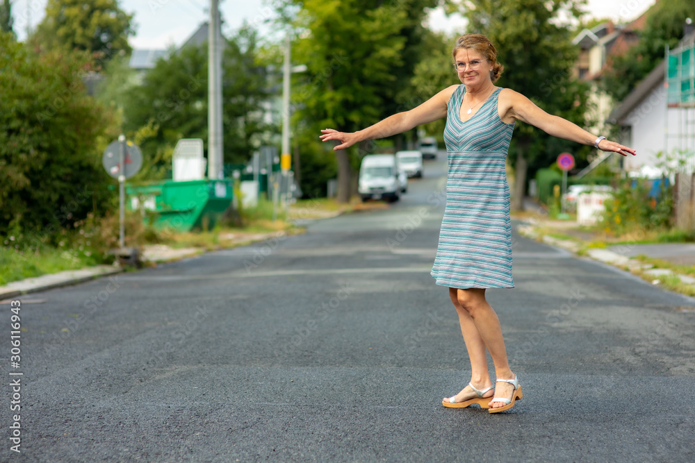 Woman with rotating poses on the road Woman with rotating poses on the road