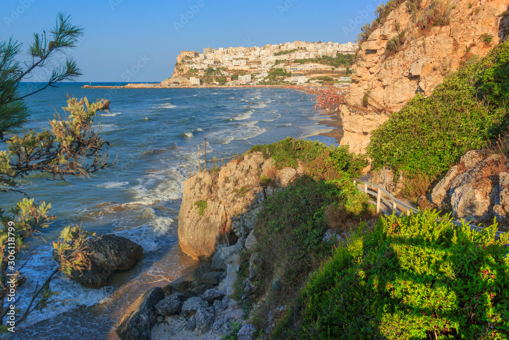 View of the bay of Peschici: the marina and the sandy beach, Italy (Puglia). Peschici is famous for its seaside resorts, its territory belongs to the Gargano National Park.