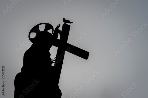 Vatican city, June 08, 2019: Silhouette Of Jesus Christ statue at the top of Saint Peter's Basilica in Saint Peter's square at the Vatican.