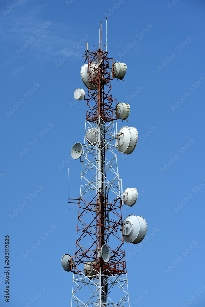 Wireless Communication Antenna With bright sky.Telecommunication tower with antennas.High pole for signal transmission. There are both wireless phone systems and microwave systems. Wireless Communication Antenna With bright sky.Telecommunication tower with antennas.High pole for signal transmission. There are both wireless phone systems and microwave systems.