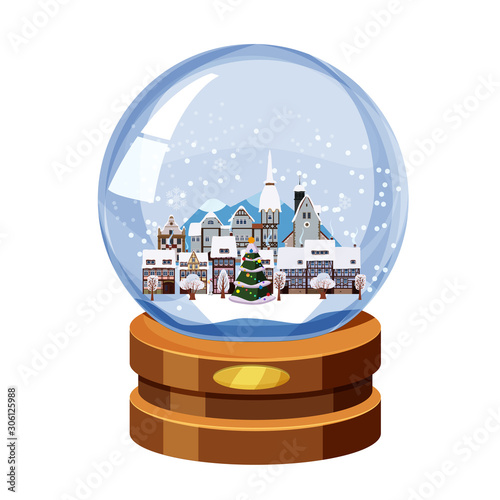 Christmas souvenir snow globe with little town in winter fir-tree