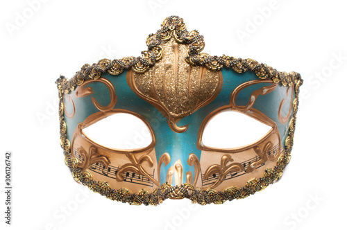 Blue venetian theatre mask with musical notes and gold decorations isolated on white background © cristianstorto