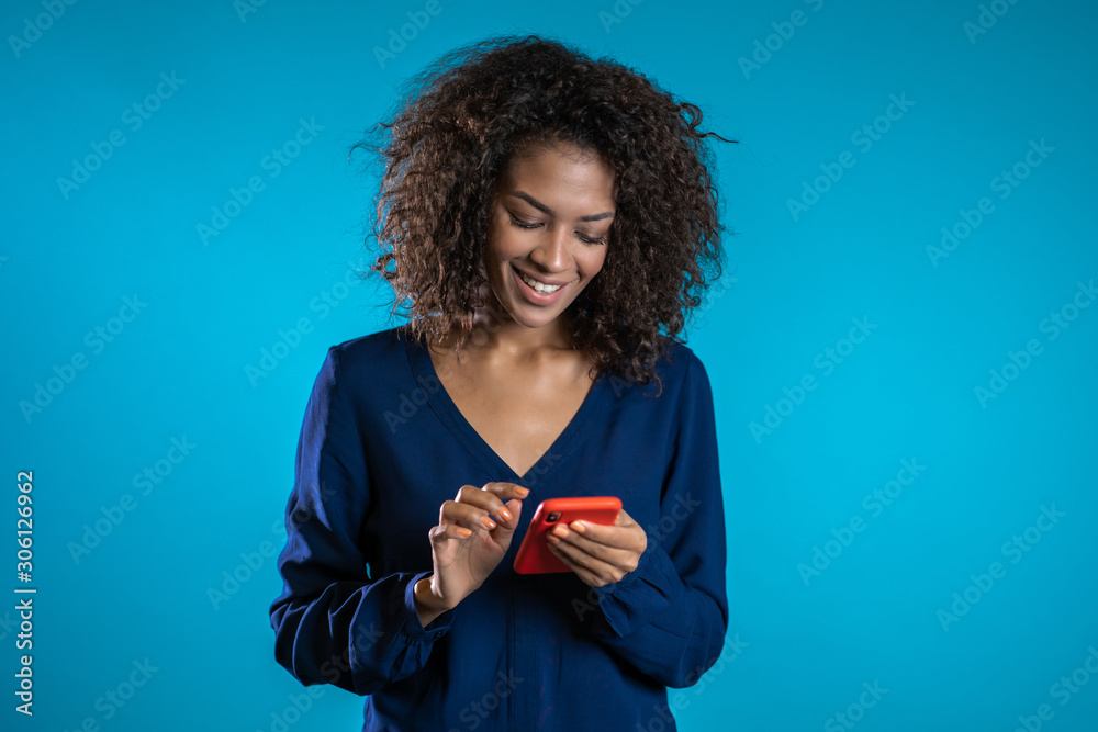 Businesswoman with smartphone. Student girl using cell phone. Beautiful woman surfing internet on mobile device. Female with modern technology device. - obrazy, fototapety, plakaty 