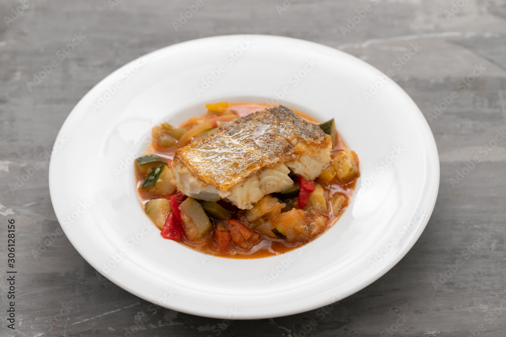 cod fish with vegetables in white plate cod fish with vegetables in white plate