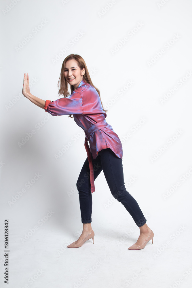 Full body of beautiful young asian woman push something. Full body of beautiful young asian woman push something.
