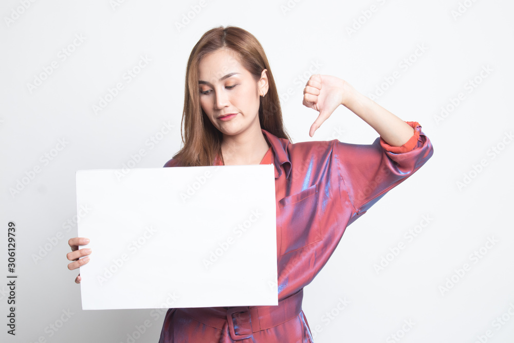 Young Asian woman show thumbs down with white blank sign. Young Asian woman show thumbs down with white blank sign.