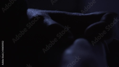 cold nervous hands in dark room photo