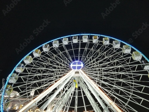 carousel wheel with illuminated cabs photo