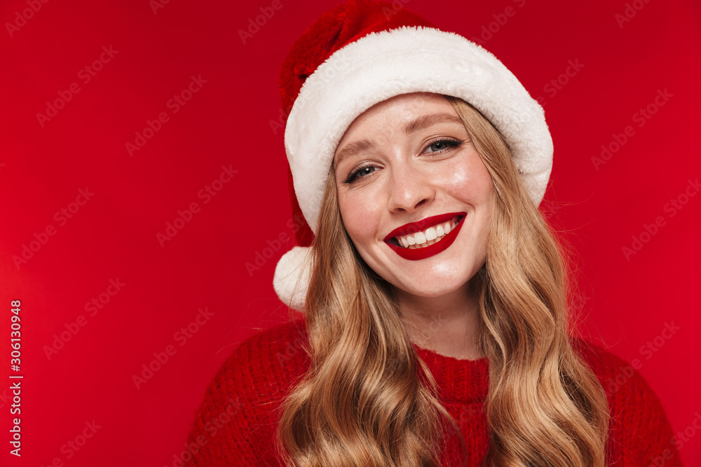 Positive caucasian woman wearing christmas hat. Positive caucasian woman wearing christmas hat.