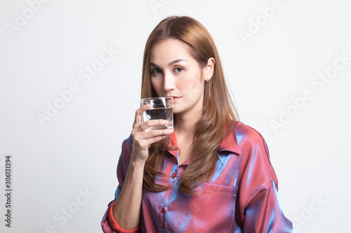 Young Asian woman with a glass of drinking water.