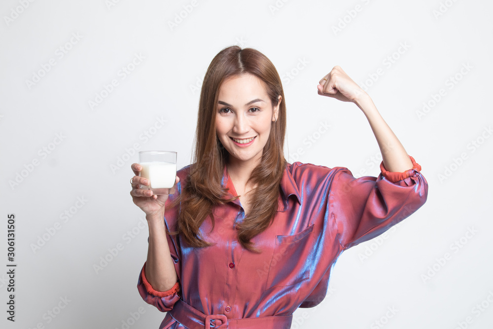 Healthy Asian woman drinking a glass of milk. Healthy Asian woman drinking a glass of milk.
