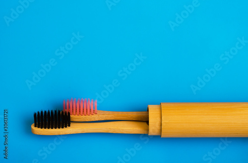eco natural bamboo toothbrushes on blue background. zero waste flat lay 16