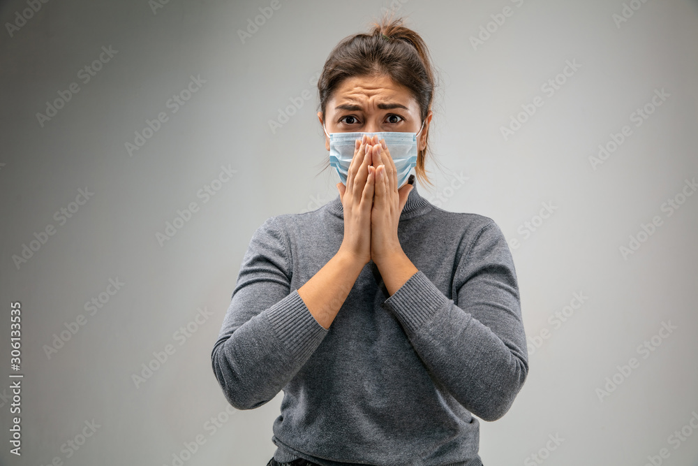 Can't breathe. Caucasian woman wearing the respiratory protection mask against air pollution and dust particles exceed the safety limits. Healthcare, environmental, ecology concept. Allergy, headache. Can't breathe. Caucasian woman wearing the respiratory protection mask against air pollution and dust particles exceed the safety limits. Healthcare, environmental, ecology concept. Allergy, headache.