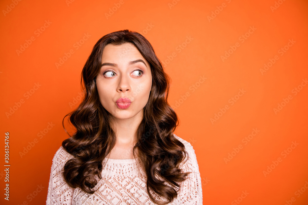 Fototapeta premium Portrait of funny funky pretty girl look copy space watch boyfriends want send air kiss on holidays wear white feminine outfit isolated over orange color background