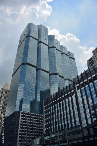 Image of building and condo building at blue sky background.
