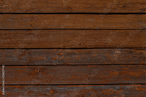 Orange and brown old wooden texture background. Scratched weathered wooden wall close up. Copy space 