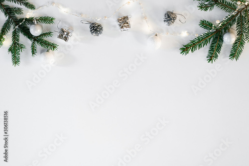 Christmas or new year background. Composition of Christmas decorations and fir branches on white . Flat lay. Symbolic image. White background. Copy space. The view from the top.