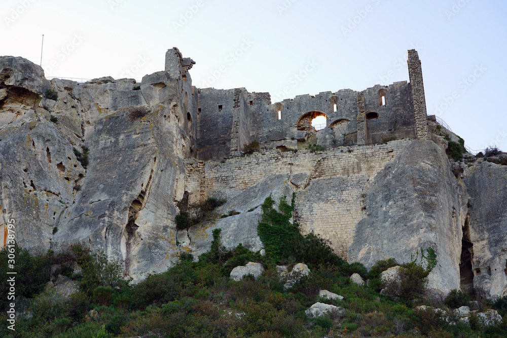 View of the historic fortified medieval castle in the village of Les-Baux-de-Provence, atop a hill in the Alpilles in Bouches du Rhone, Provence, France