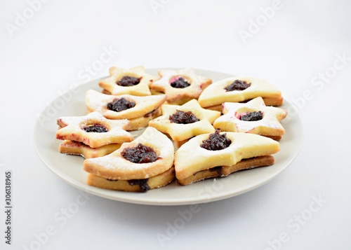 Homemade Christmas cookies star with jam and sugar powder