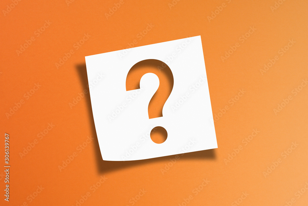 Note paper with question mark on orange background Note paper with question mark on orange background