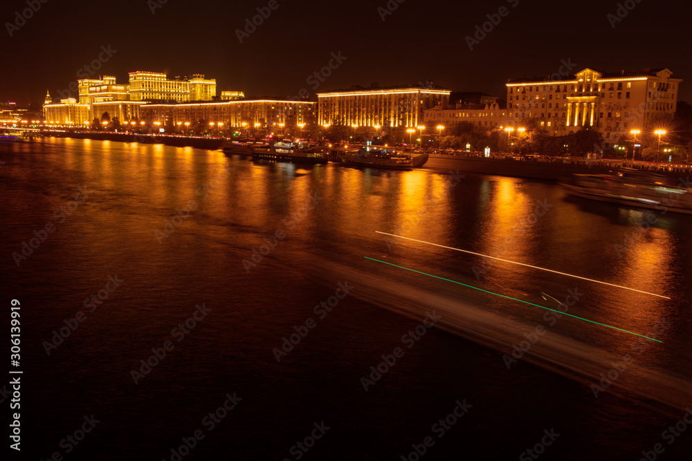Moscow river with ships at night as background
