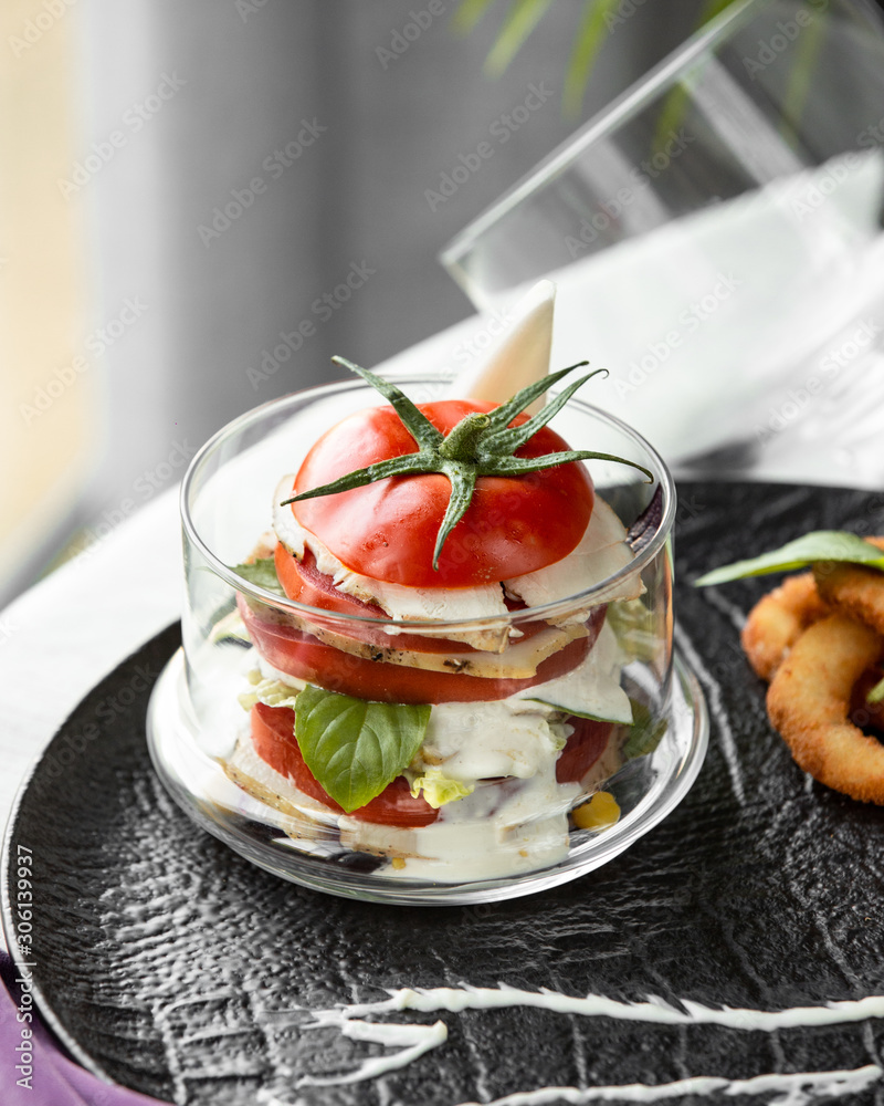 sliced tomato filled with white cheese sliced tomato filled with white cheese